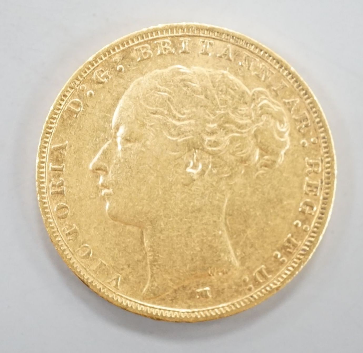 A Victoria 1883 gold sovereign.